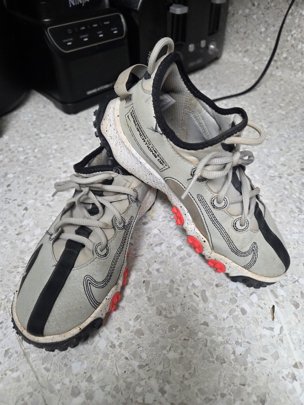 Nike Kids  Gray,  Black and Red Baseball Cleats.